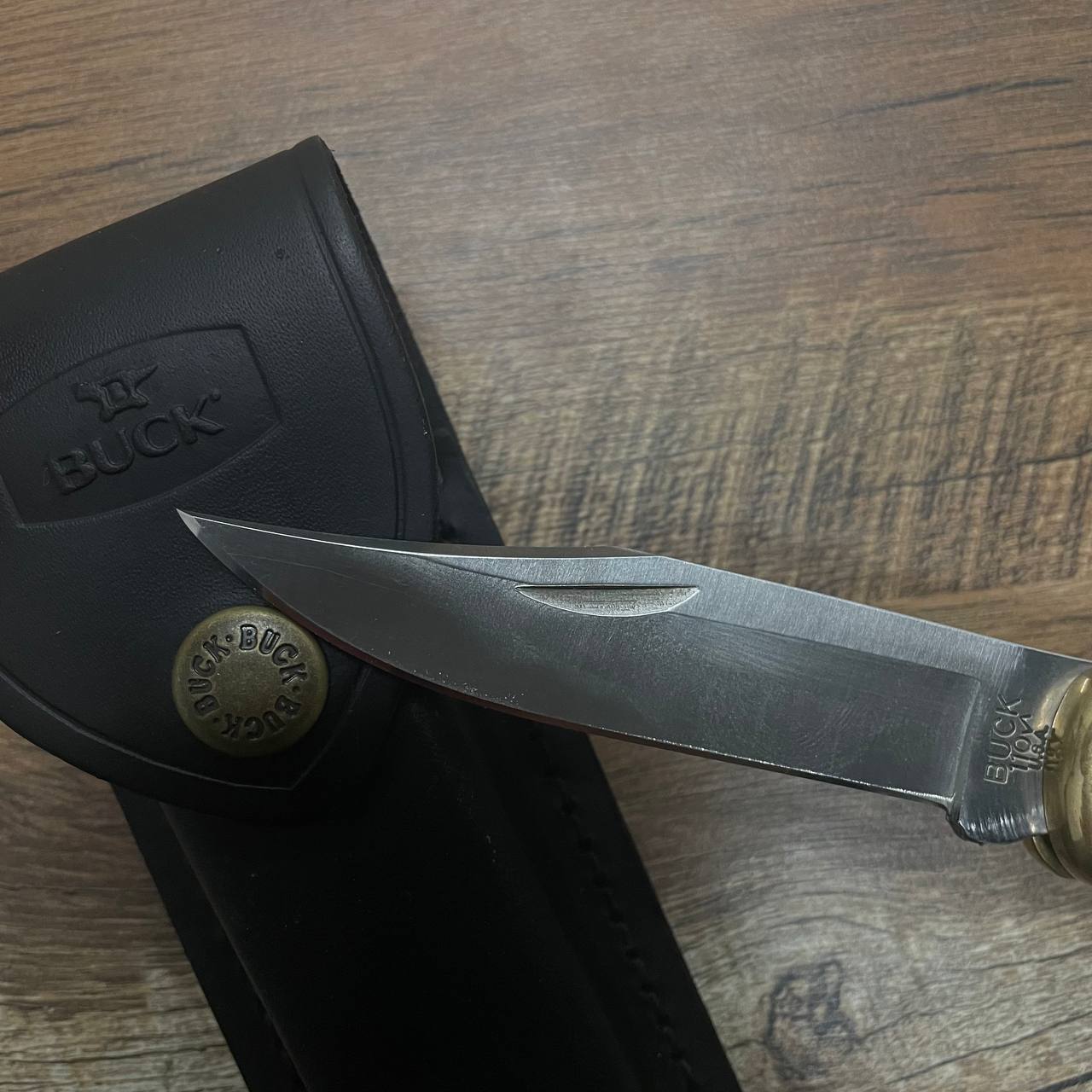 Thumbnail for article "How to fix a broken knife tip". Picture of a knife resting on a sheath