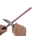 TSPROF ruby ceramic honing rod held in one hand and a knife in the other, with the cutting edge positioned next to the rod on a white background.